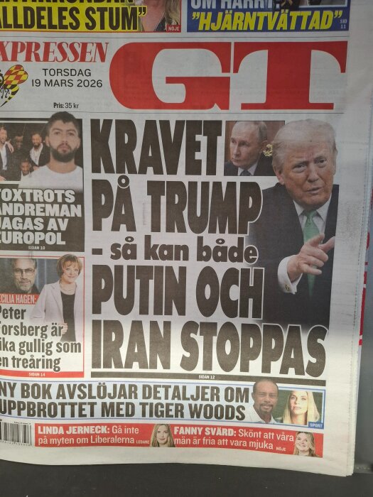 Framsida av GT-tidning från 19 mars 2026 med rubrik om krav på Trump relaterat till Putin och Iran, inklusive artiklar om Europol och Tiger Woods.