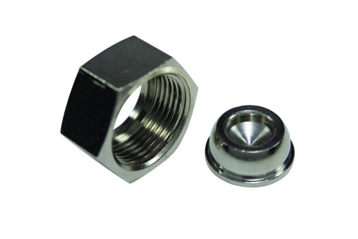 Två metallproppar, en octagonal och en konisk, ligger sida vid sida.