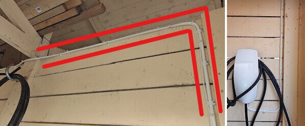 Elkabel som löper längs taket och väggen markerad med röda linjer, bredvid en vit laddstation för elbil.