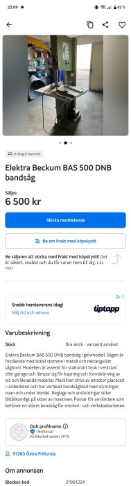 Bandsåg Elektra Beckum BAS 500 DNB i en verkstad med tillbehör på hyllor i bakgrunden.