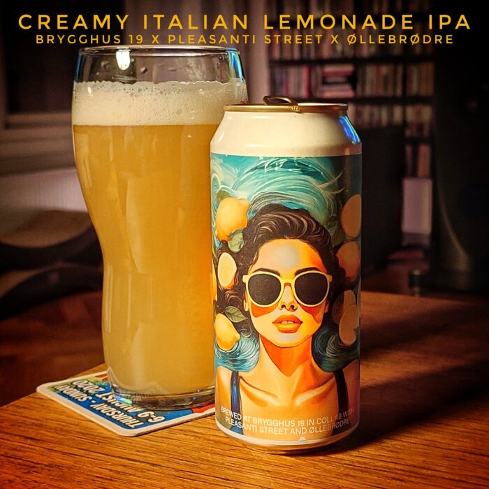En burk Creamy Italian Lemonade IPA bredvid ett glas öl, etiketten visar en kvinna med solglasögon och citronmotiv.