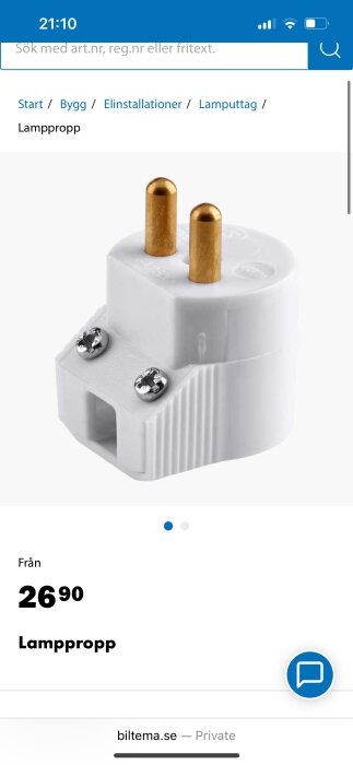 Vit lamppropp med två guldfärgade stift och två skruvar, från Biltema.