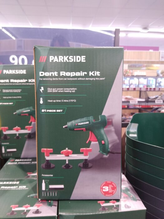 Parksides buckelborttagningskit för bilkaross med limpistol visas på förpackning, marknadsført för att avlägsna bucklor utan att skada lacken.