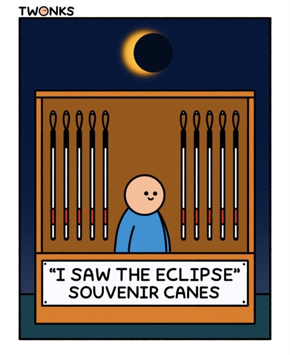 En tecknad souvenirstånd säljer käppar med texten "I saw the eclipse", medan en solförmörkelse syns i himlen ovanför.
