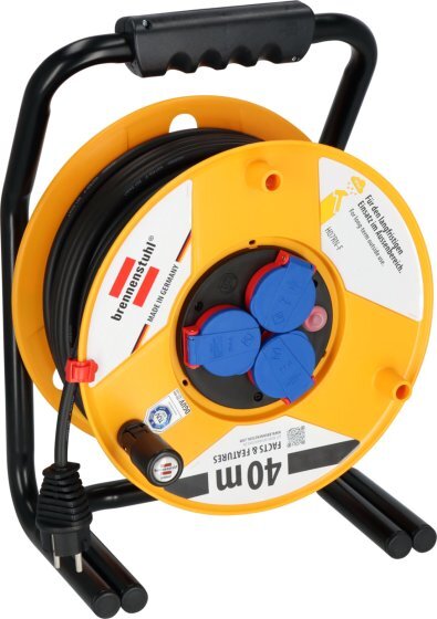 Bilden visar en gul och svart Brennenstuhl kabelvinda med flera uttag, märkningen "40 m" synlig. Vindan är robust och av proffsmodell.