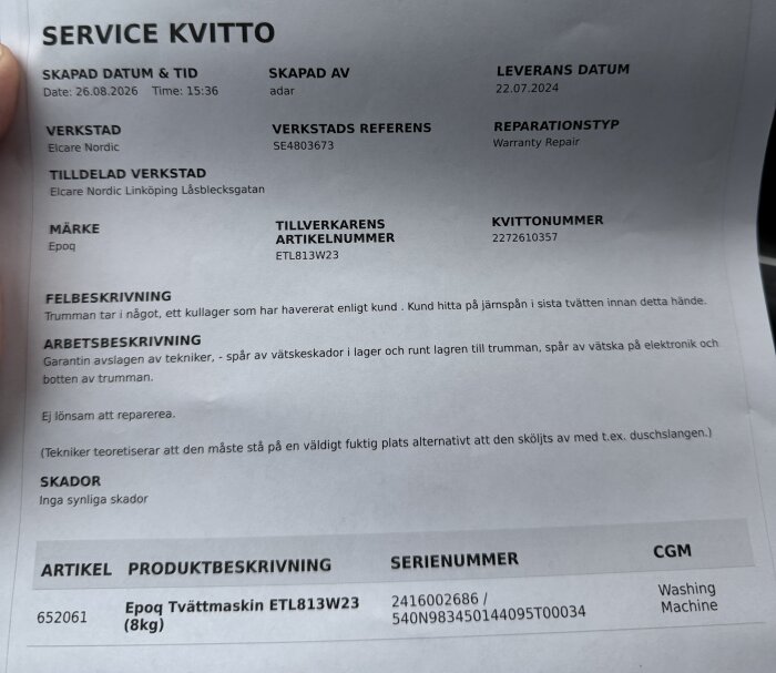 Servicekvitto för en Epoq tvättmaskin med information om havererat kullager och serviceteknikerns bedömning om vätskeskador.