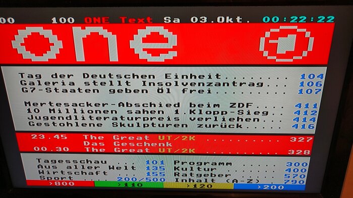 Text-TV-bild på tysk kanal "ONE" med nyheter och programtablå i pixlad stil. Överst datum och tid, rubriker som "Tag der Deutschen Einheit".