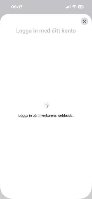 Inloggningsskärm med meddelandet "Logga in på tillverkarens webbsida" och laddningsikon i mitten av en mobiltelefon.
