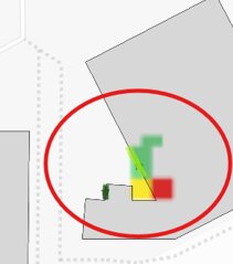Karta med en byggnads hörn markerat i en röd cirkel; området visar markerade riskzoner med färgerna röd, gul och grön.