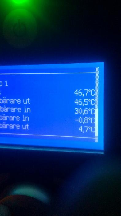 Digital display showing temperatures for a heat pump system; includes measurements for exhaust, incoming, and outgoing heating and cooling mediums.